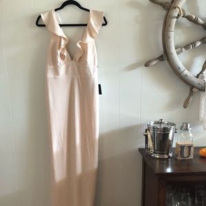 Blush gown with low back and ruffle sleeves